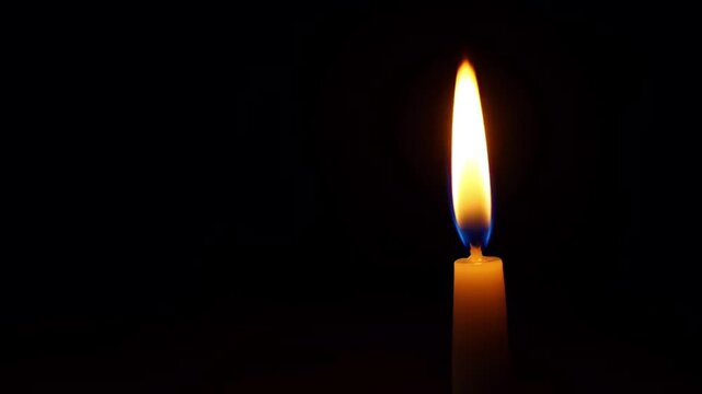 Realistic single candle burning at right in Dark Background.