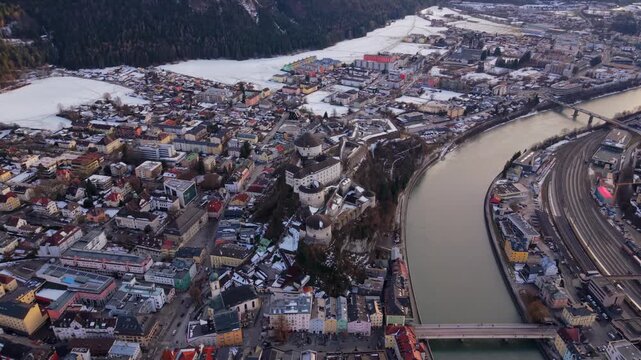 Winter aerial of Kufstein, Tyrol. Landmark fortress and alpine architecture from above. Festung Kufstein Luftaufnahme am Inn Fluss. Cultural heritage site in Oesterreich during winter.