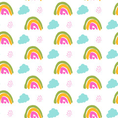Fototapeta premium Seamless pattern with rainbows and fluffy clouds in cute hand drawn style. Soft pastel background for nursery design, kids fabric, wallpaper and baby products.