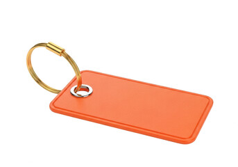 Fototapeta premium A bright orange keychain with a gold-colored keyring attached to it. isolated on transparent background