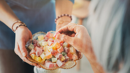 Visiting relatives and offering candy during Eid al-Fitr celebration