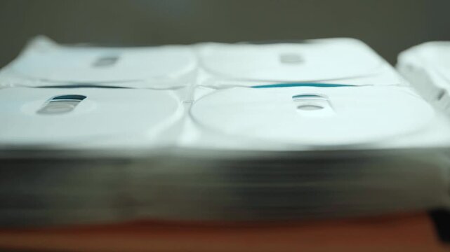 Collection of DVD and CD discs stored in a folder.