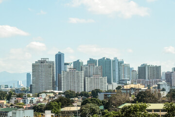 Fototapeta premium Cityscape and skyline. Buildings right next to each other and overlapping in the view. Urban development and progress.