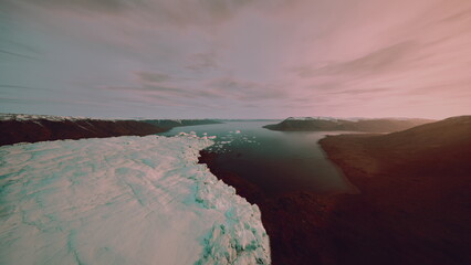 Aerial view melting glacier meeting river and dark volcanic shore under pink twilight sky, drifting ice floes, calm inlet water, slow atmospheric clouds, remote © icetray