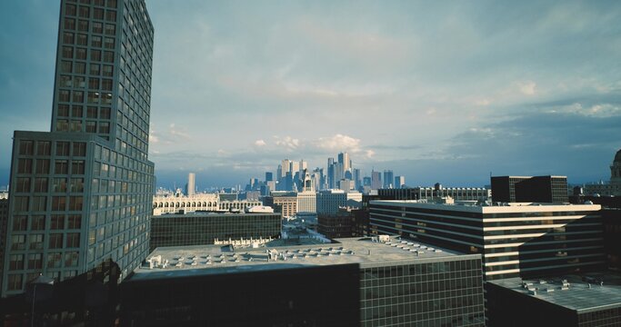 wide rooftop vantage showing urban skyline, planning perspective with blocks and street grid, useful for masterplan and infrastructure concept visuals