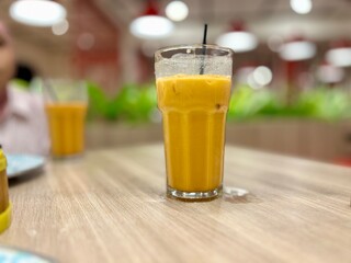 Fototapeta premium glass of thai tea on the table