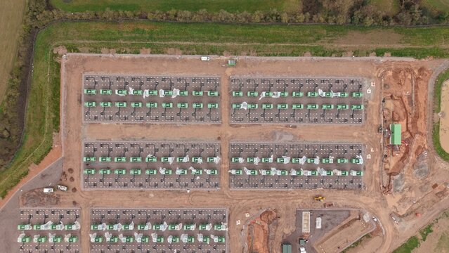 Aerial view of the new Battery Energy Storage Systems BESS at National Grid Hams Hall Substation, a symphony of green and brown, Birmingham, United Kingdom.