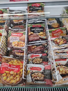 Saujon, France - January 24, 2026: Intermarche. Frozen potato products displayed in a supermarket freezer, featuring brands Saint Eloi and Pom Bistro with various packaging designs