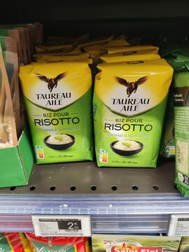 Saujon, France - January 24, 2026: Intermarche. Taureau Aile risotto rice packaging displayed on supermarket shelf, featuring green and yellow design with clear product labeling
