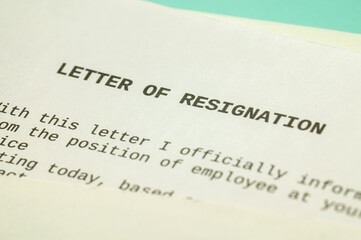 Employee resignation letter and pen beside. 
