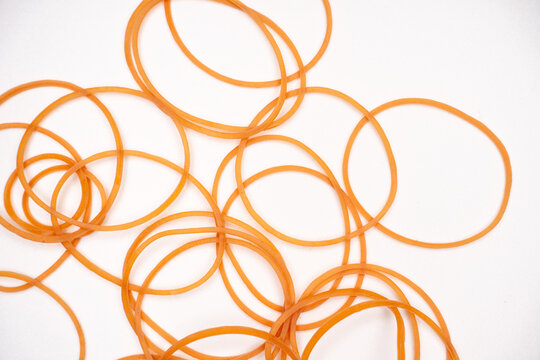 Assorted Elastic Rubber Bands on Minimal White Surface