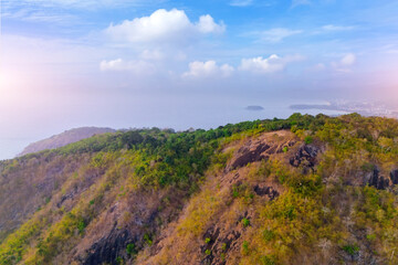 Obraz premium Majestic mountains Black Rock top with green and golden brown foliage stretch under a clear blue sky