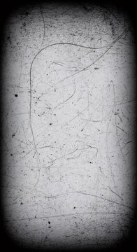 Scary retro background with dark vignette for a horror texture. Grungy, vintage film effect with scratches and dust. Old paper concept for a creepy backdrop.