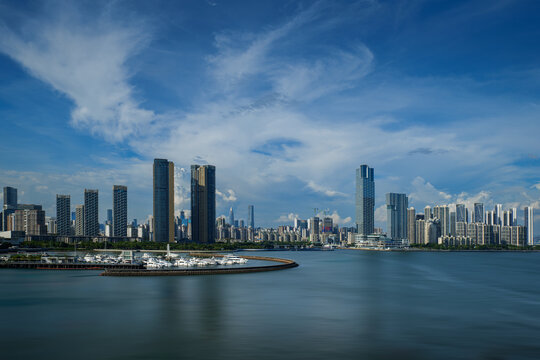 Modern Urban Skyline and Bay Under Blue Sky