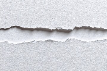 Close-up of ripped white paper, showing the textured edges and void created