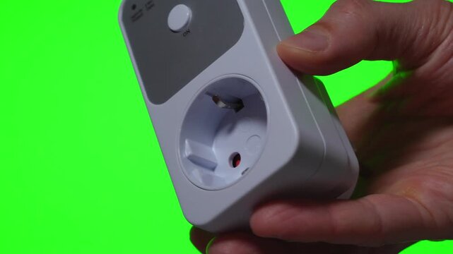 Automatic voltage protection relay device rotating on green background