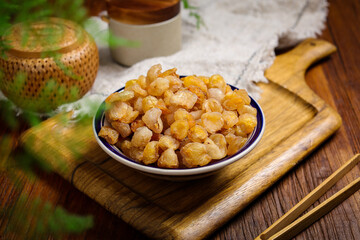 Dried Longan Fruit in Bowl with Fresh Longans