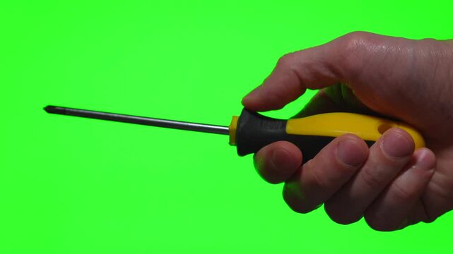 A metal screwdriver in a hand against an isolated background.
A close-up of a construction tool.
A device for driving screws and self-tapping screws.