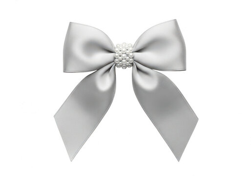 A large silver ribbon bow with a sparkling centerpiece isolated on transparent background