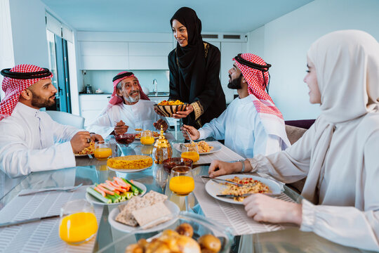 Arab family enjoying traditional meal together during ramadan