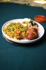 Fototapeta premium Delicious fried rice with chicken and vegetables on plate