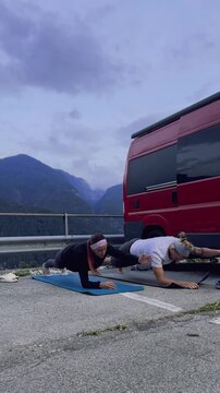 Advanced Plank Variation &ndash; Outdoor Training

Athletic couple performing advanced plank variation with arm and leg extension, mountain landscape, endurance and strength training.