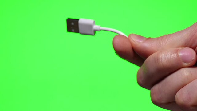 USB cable close-up in hands on isolated background