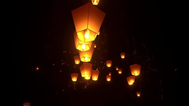 Floating lanterns illuminating the night sky during a festival. Symbolizing hope, celebration, and the release of wishes into the universe