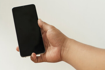 Close‑Up of Hand with Smartphone on White Background
