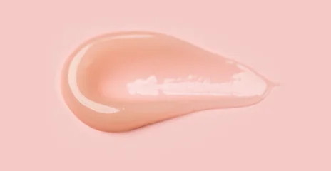 Balm, natural cream gel serum smear on pink background. Natural beige collagen creme stroke swatch cosmetic product top view. Beauty product sample swatch, peptides, moisturizing mask, skin care © Subbotina Anna