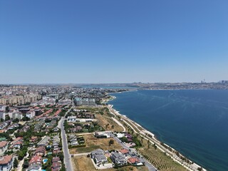Aerial Panoramic View of Coastal Residential Neighborhood and Blue Sea Horizon