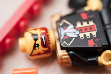 Naklejka premium Gothenburg, Sweden - February 20 2010: Lego mini figure in a pile of bricks.