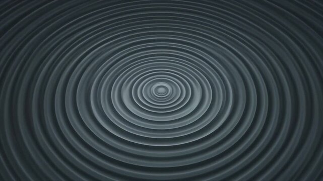 Dark gray concentric circles rippling outward in a spiral pattern creating a sense of depth and motion