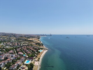 Aerial Panoramic View of Coastal Residential Neighborhood and Blue Sea Horizon