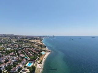 Aerial Panoramic View of Coastal Residential Neighborhood and Blue Sea Horizon