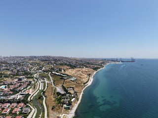 Aerial Panoramic View of Coastal Residential Neighborhood and Blue Sea Horizon