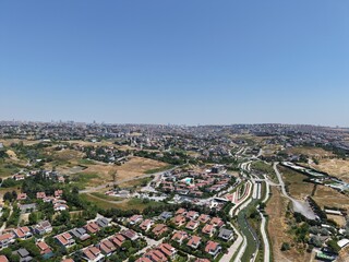 Obraz premium Aerial Panoramic View of Coastal Residential Neighborhood and Blue Sea Horizon