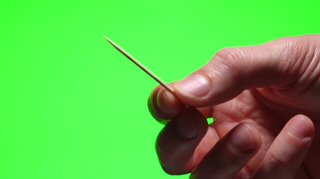 A toothpick for oral hygiene.
A wooden toothpick for oral hygiene.
