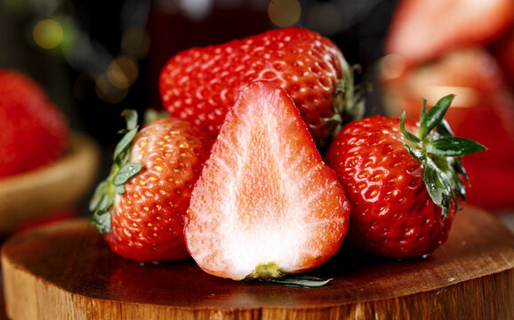 Fresh Strawberries Still Life with Cut Half Showing Rich Juicy Interior and Natural Vitamin Content