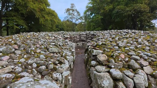 Historic Prehistoric Stone Cairn Monument at Clava Cairns Near Inverness Scotland Captured in Detailed Cinematic Video Highlighting Ancient Burial Site and Archaeological Landscape