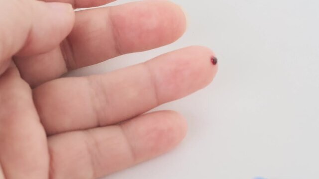 Finger prick for blood self-testing, Blood self-test procedure, showing finger prick step for personal health monitoring, convenience and accessibility at-home health diagnostics