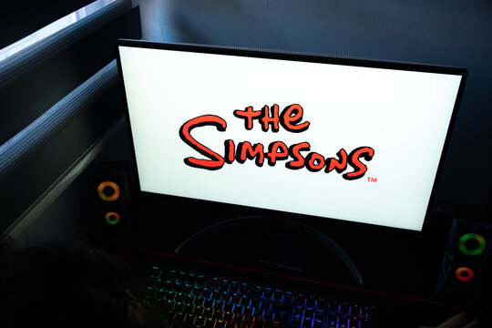 Punta Arenas, Chile &ndash; March 07, 2026: A desktop PC monitor showing the official The Simpsons logo in a dark room with a backlit gaming keyboard in view
