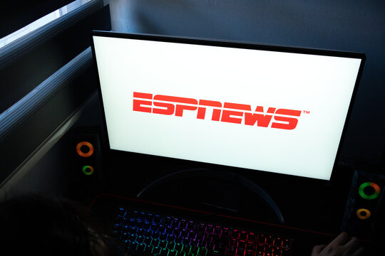 Punta Arenas, Chile &ndash; March 07, 2026: A desktop PC monitor showing the official ESPNEWS sports news logo in a dark room with a backlit gaming keyboard in view