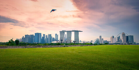 Singapore city Skyline and view of skyscrapers on Marina Barrage at sunset. © nuttawutnuy