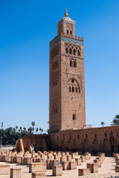 Marrakech - Kutubiyya Mosque, the minaret tower, above it with a dome and  four orbs on top. Moorish style, Morocco