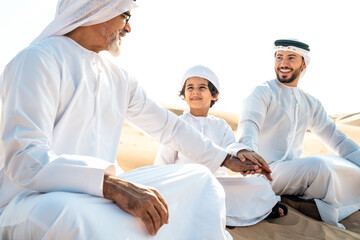Obraz premium Three generation family making a safari in the desert of Dubai