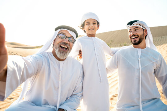 Three generation family making a safari in the desert of Dubai