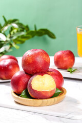 Fresh Nectarines with Yellow Flesh on White Marble Surface - Healthy Summer Fruit