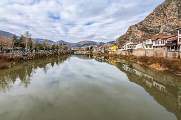 Fototapeta premium Old Ottoman houses panoramic view by the Yesilirmak River in Amasya City. Amasya is populer tourist destination in Turkey.