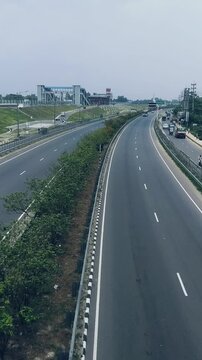 Traffic on highway top view from footware over bridge vertical